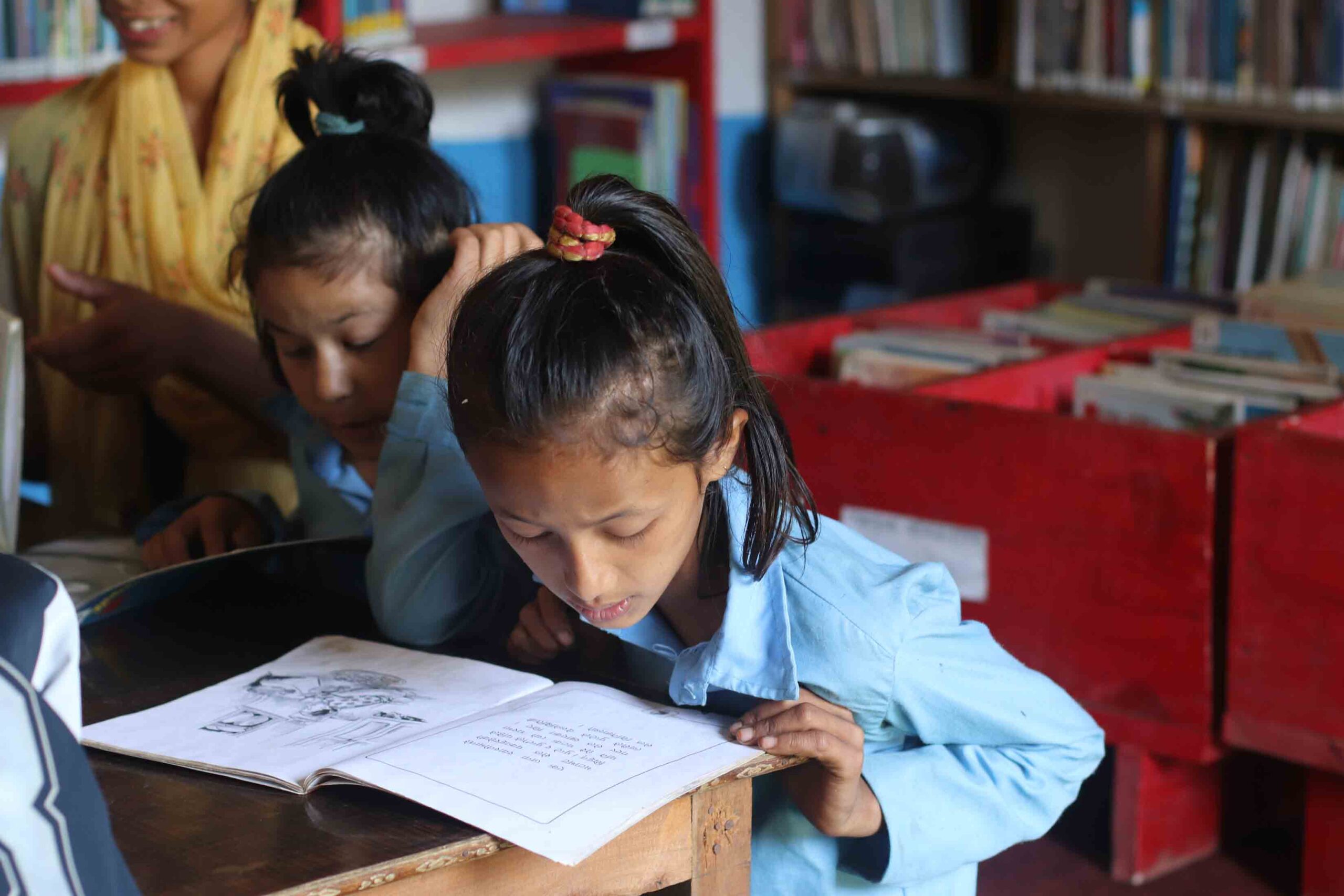 Build-A-Library--Kids-Studying-Books Kids studying on a library